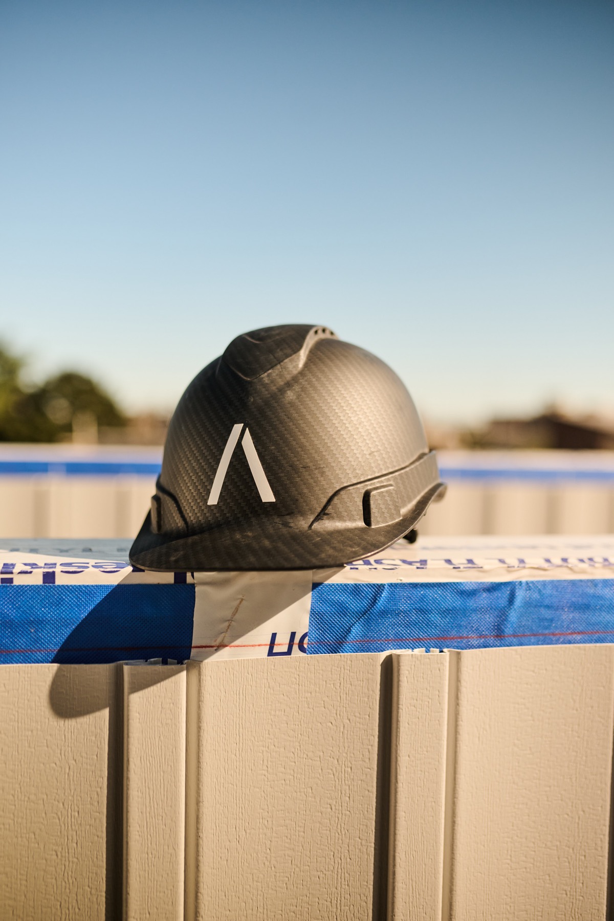 AXE Builders hard hat on a job site